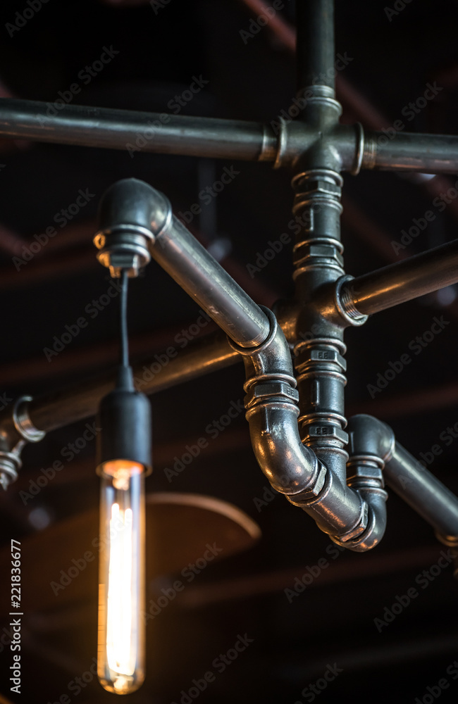 Pipes, fittings and lamp on dark background Pipes, fittings and lamp on dark background