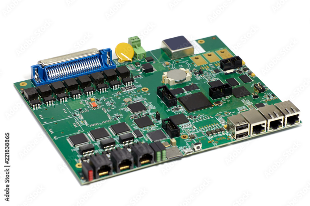 Electronic printed circuit board with chips and other components, green color, back side, angled view, isolated on white background Electronic printed circuit board with chips and other components, green color, back side, angled view, isolated on white background