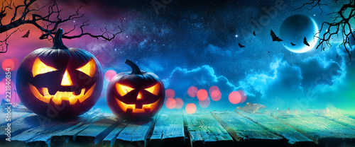 Halloween Pumpkins Glowing In Fantasy Night
