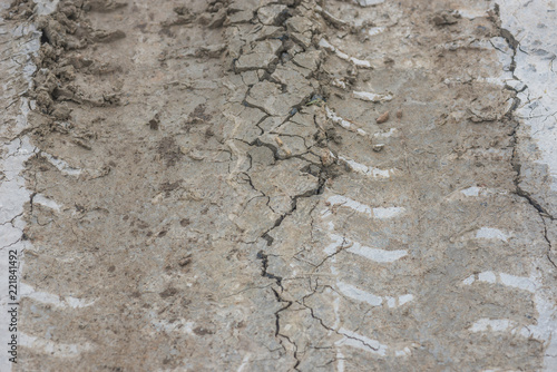 Wheel car track on wet cement concrete floor for background © motestockphoto