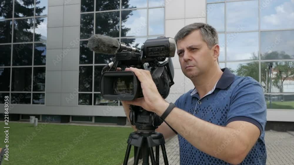 The videographer is busy with the shooting process. Creative profession operator The videographer is busy with the shooting process. Creative profession operator