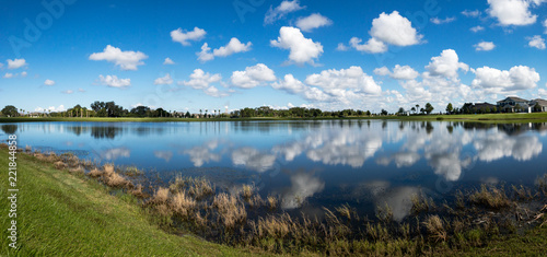 Fototapeta Naklejka Na Ścianę i Meble -  Pond Reflecting the Sky on a Sunny Day