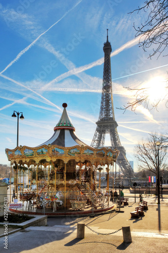 Beautiful backlit Eiffel tower at the carousel with a dramatic sky in winter   © dennisvdwater