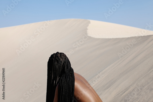 young woman and a sand dune  photo