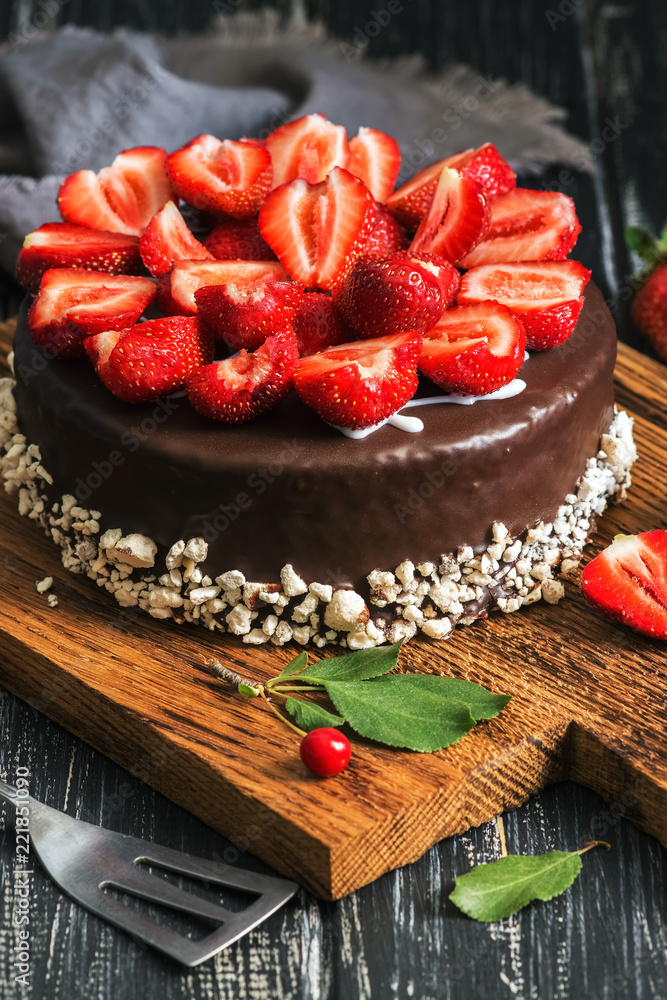 Chocolate cake with fresh strawberries, selective focus.