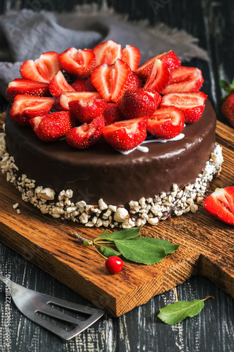 Chocolate cake with fresh strawberries, selective focus.