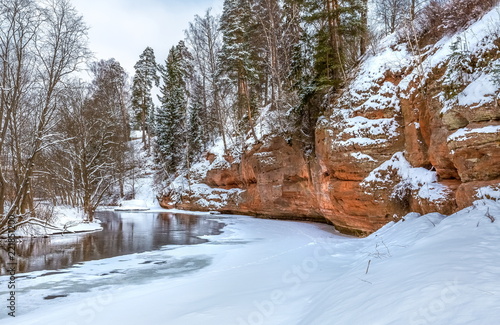 Red river bank. Geological exposure of the Devonian on the Oredezh River, in the north of Russia. photo