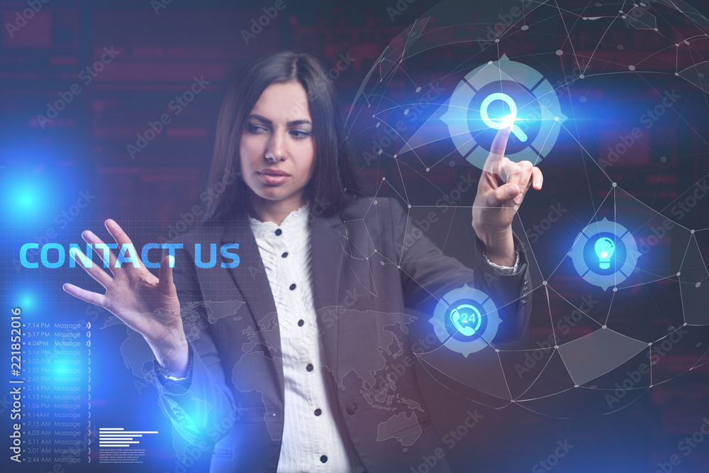 The concept of business, technology, the Internet and the network. A young entrepreneur working on a virtual screen of the future and sees the inscription: Contact us The concept of business, technology, the Internet and the network. A young entrepreneur working on a virtual screen of the future and sees the inscription: Contact us