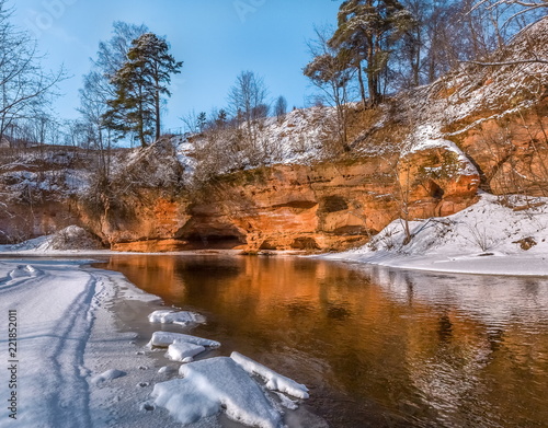 Red river bank. Geological exposure of the Devonian on the Oredezh River, in the north of Russia. photo