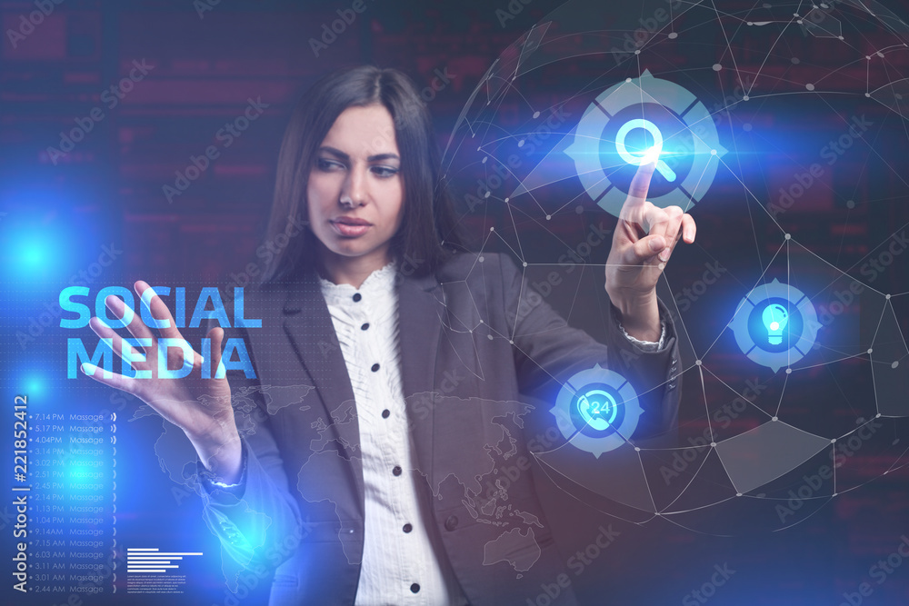 The concept of business, technology, the Internet and the network. A young entrepreneur working on a virtual screen of the future and sees the inscription: Social media The concept of business, technology, the Internet and the network. A young entrepreneur working on a virtual screen of the future and sees the inscription: Social media