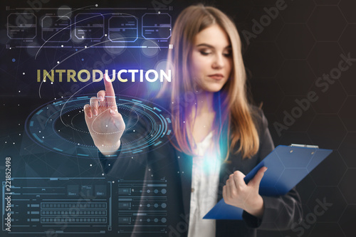 The concept of business, technology, the Internet and the network. A young entrepreneur working on a virtual screen of the future and sees the inscription: introduction