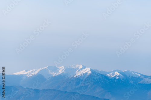 Winter landscape with mountain tops in the snow © Oleksandr Kotenko
