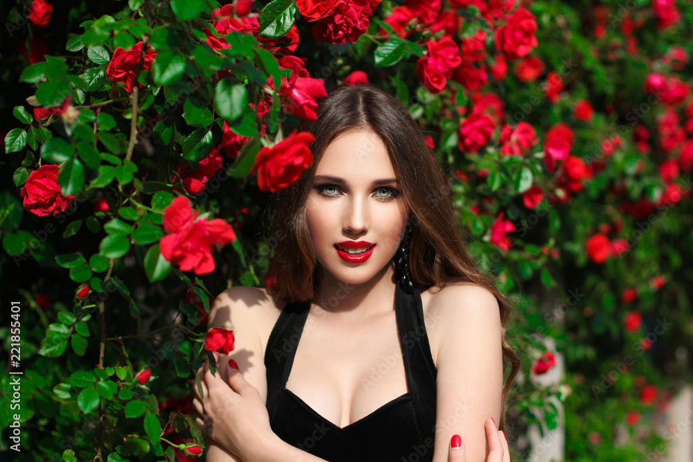 Portrait of beautiful young woman in the rose garden, spring time, rose flowers blossoms. Portrait of beautiful young woman in the rose garden, spring time, rose flowers blossoms.