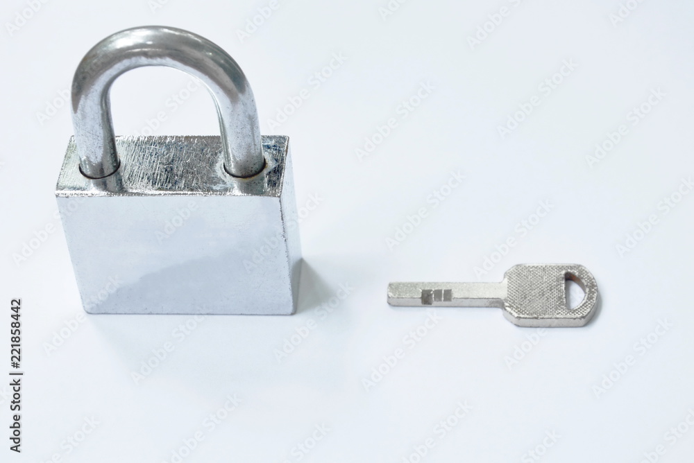 padlock and key on wooden white background padlock and key on wooden white background