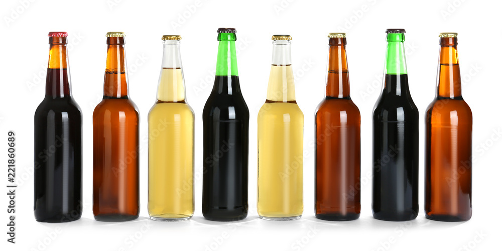 Bottles with different beer on white background Bottles with different beer on white background