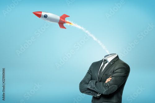A businessman with crossed arms and with a small launched old-school rocket instead of his head.