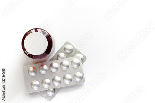 Fotografie Medicine bottle and in a blister pack on white background for healthcare and med