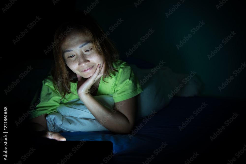 Asian woman play smartphone in the bed at night,Thailand people,Addict social media,Play internet all night Asian woman play smartphone in the bed at night,Thailand people,Addict social media,Play internet all night