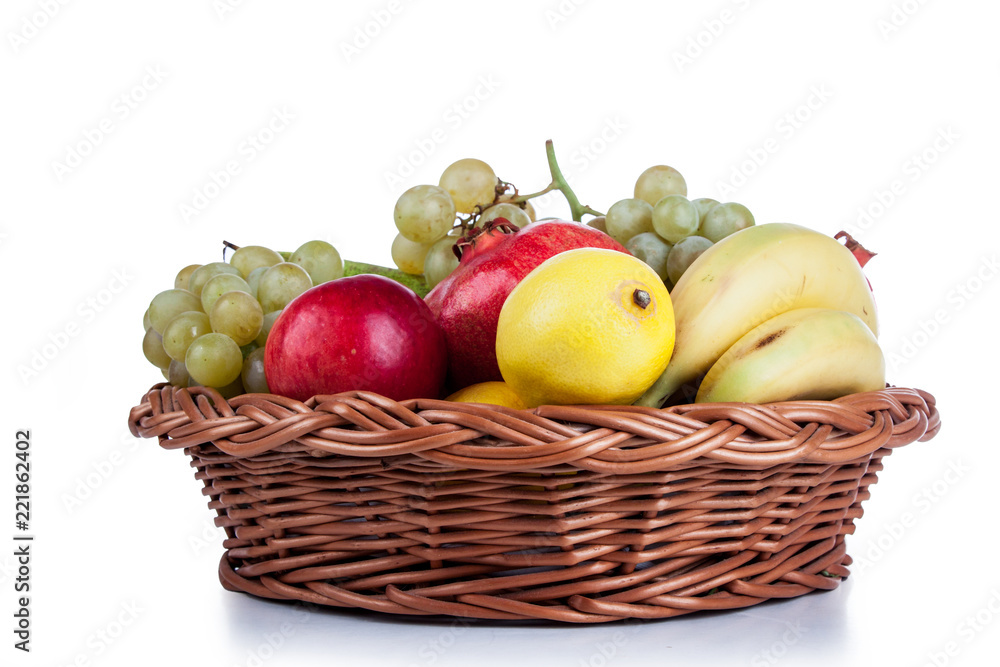 pomegranates and other fruit in the basket