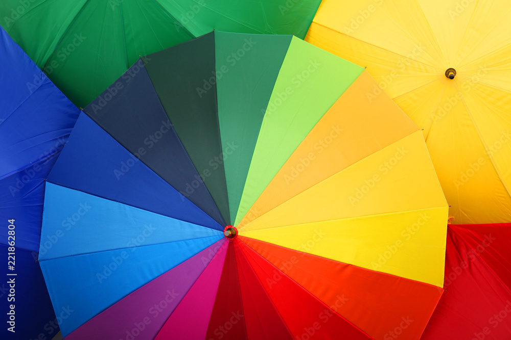 Many stylish colorful umbrellas as background, closeup