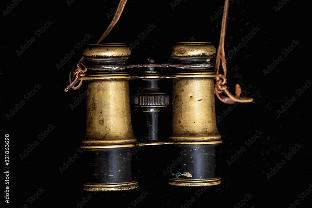 Old binoculars on dark background Old binoculars on dark background