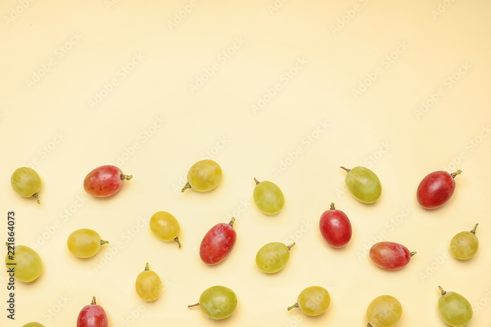 Fresh ripe juicy grapes on color background, top view. Space for text Fresh ripe juicy grapes on color background, top view. Space for text