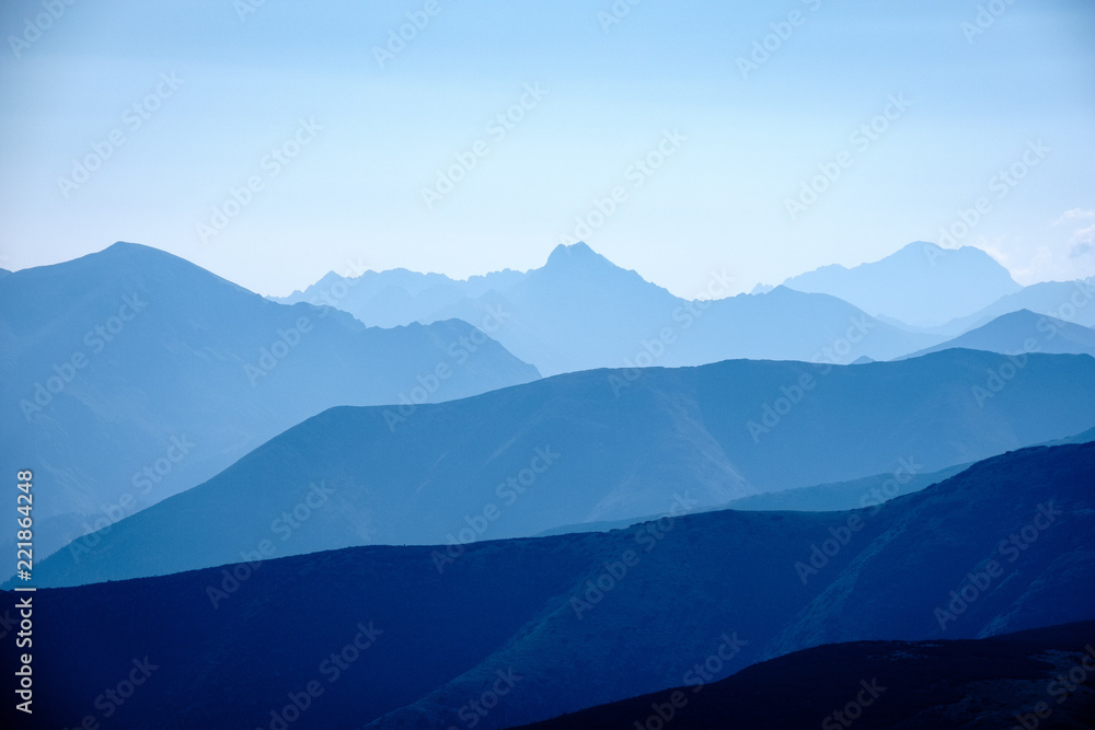 mountain top panorama in autumn covered in mist or clouds mountain top panorama in autumn covered in mist or clouds
