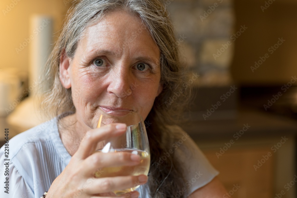 Senior woman having wine at home Senior woman having wine at home