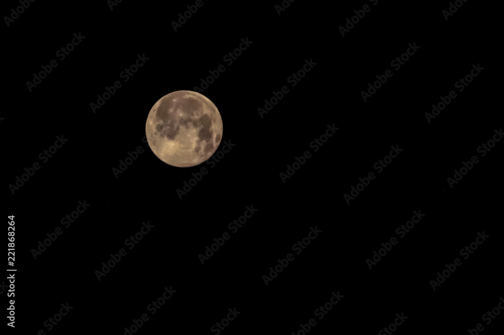 View of full moon on dark, black sky View of full moon on dark, black sky