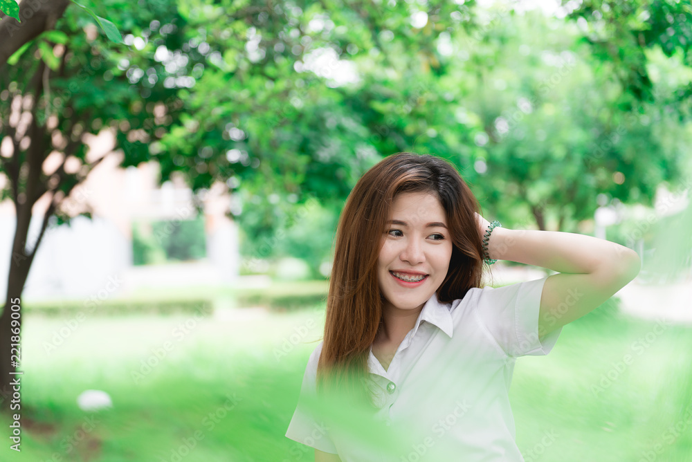 Portrait of Beautiful thai student,Cute asian girl outdoors,thailand people,Hobbie of modern student,lifestyle of single woman Portrait of Beautiful thai student,Cute asian girl outdoors,thailand people,Hobbie of modern student,lifestyle of single woman