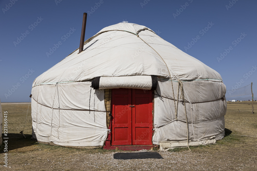 Yurt with red door at Song Kul lake in Kyrgyzstan