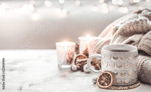 cozy winter composition with a cup and sweater photo