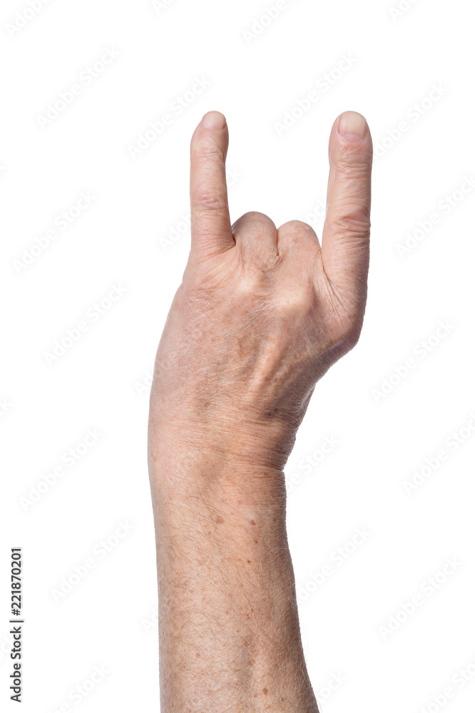 Hand of senior woman showing devil horns sign Hand of senior woman showing devil horns sign