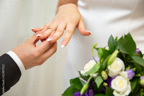 bridegroom Put the Wedding Ring on bride finger