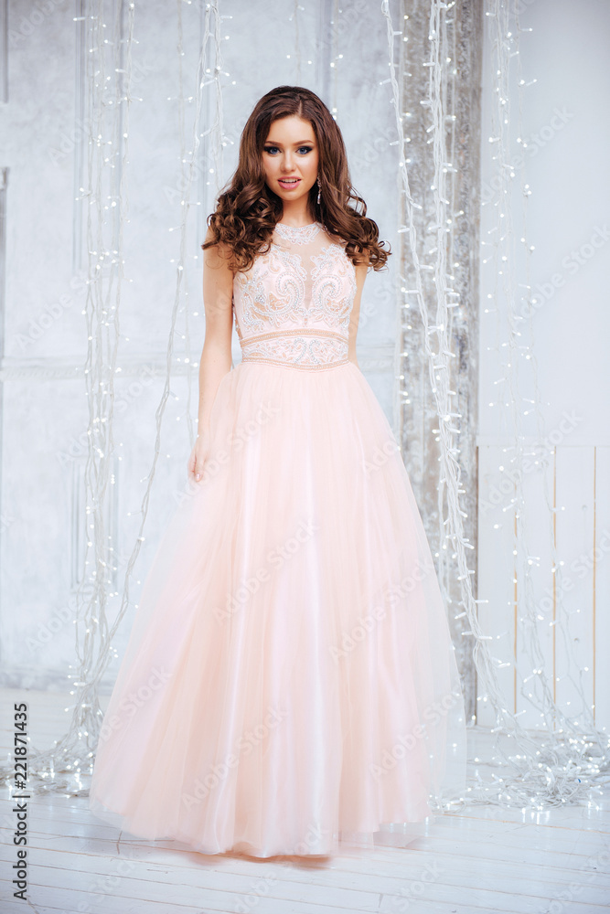 Portrait of Beautiful Brunette Bride in Lights. Fashion Dress and MakeUp
Portrait of Beautiful Brunette Bride in Lights. Fashion Dress and MakeUp