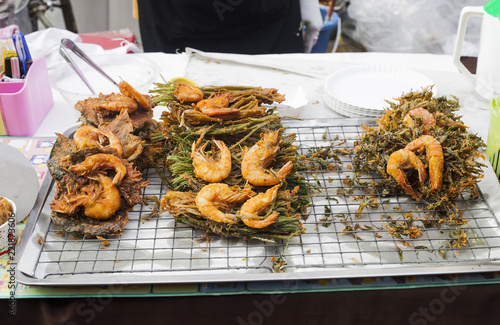 King prawns fried in batter, srimps prawn tempura on street market in Phuket, Thailand photo