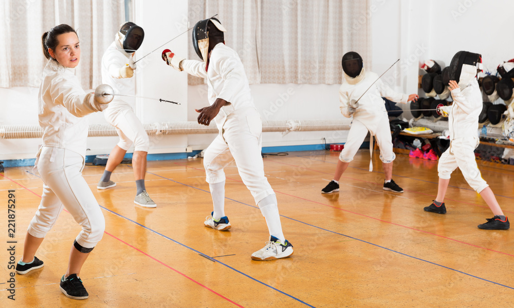 Fototapeta premium Woman training fencing movements
