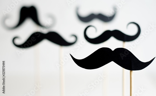 Obraz na plátne A lot of black paper moustaches on sticks