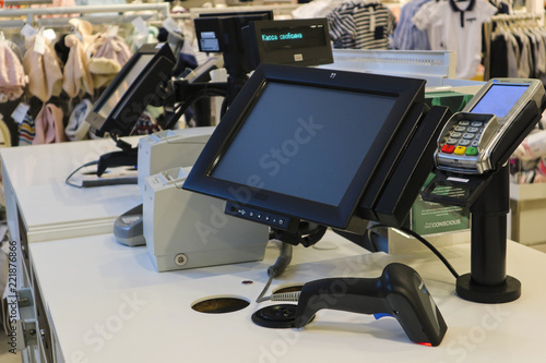 The work of the cashier. The cash register in the store