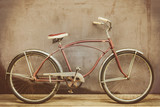 Vintage rusted cruiser bicycle on a wooden floor