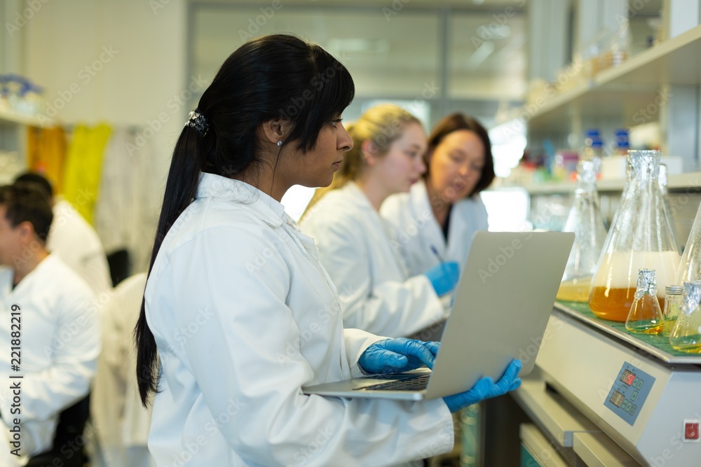 Female scientist using laptop Female scientist using laptop