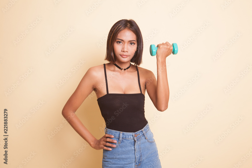 Healthy Asian woman with dumbbells. Healthy Asian woman with dumbbells.