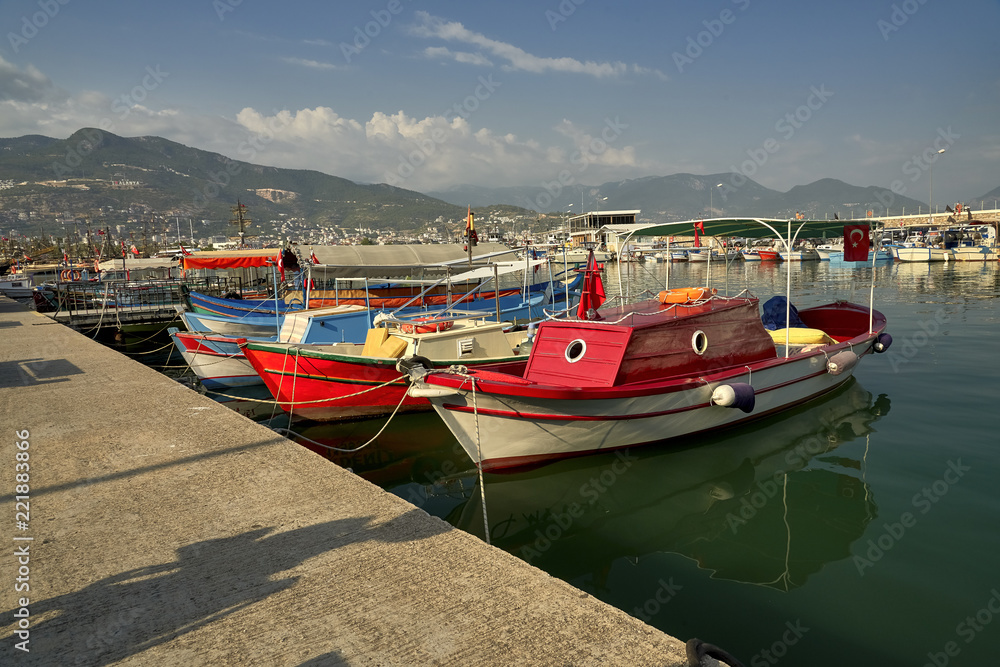 Port in Alanya, Turkey, in the foreground small fishing boats