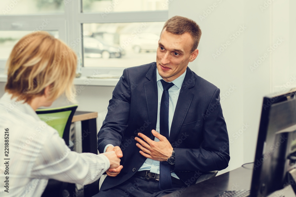 Business meeting, handshake. Interviewing. Conversation with the employee.