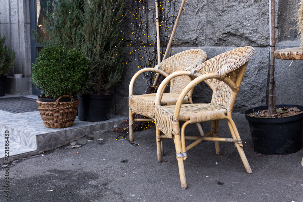 Armchairs made of straw. Rural chairs. Chairs on the street.