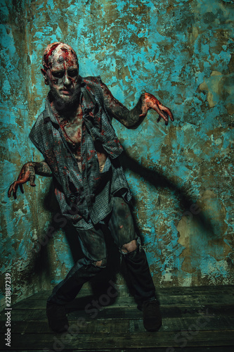 creepy zombie in corner © Andrey Kiselev