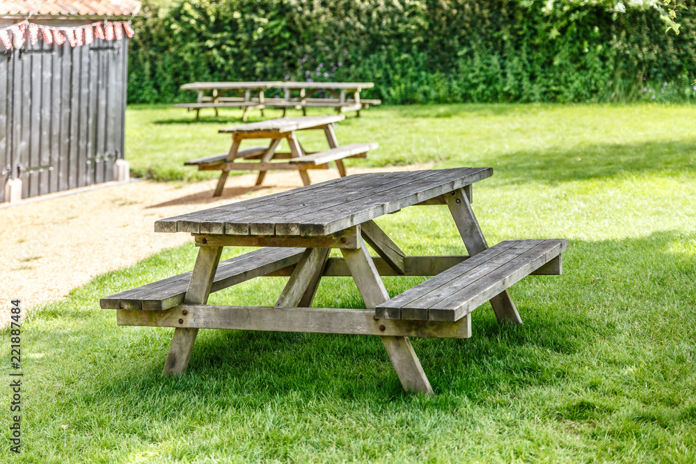 Recreation and rest area with several old wooden benches Recreation and rest area with several old wooden benches