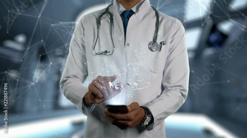 ACITRETIN - Male Doctor With Mobile Phone Opens and Touches Hologram Word Active Ingrident of Medicine photo