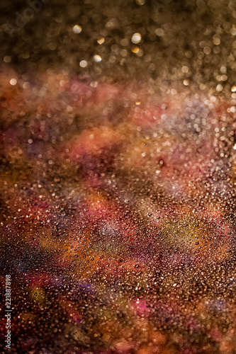 Warm toned particle abstract background.
