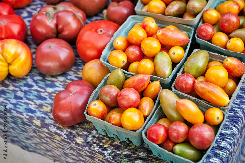 Assorted tomatoes on sale at a farmers market. Assorted tomatoes on sale at a farmers market.